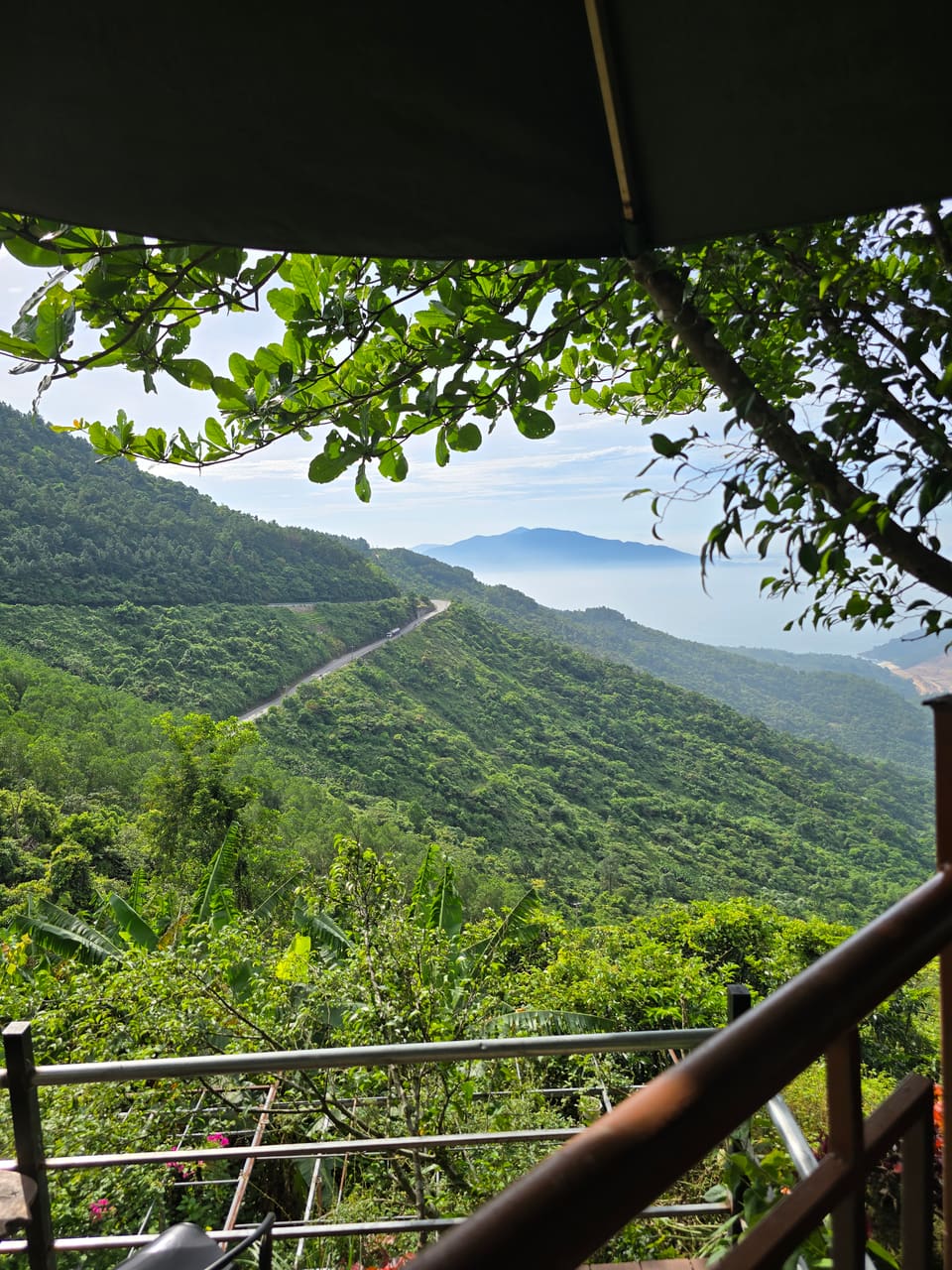 The Hải Vân Pass road winding through the mountains above the sea