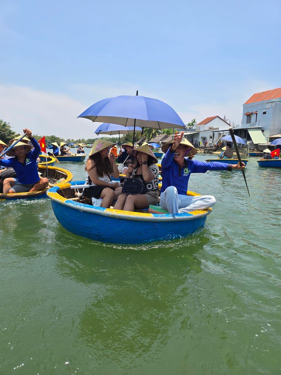 Round basket boats in the coconut-palm water village of Cẩm Thanh