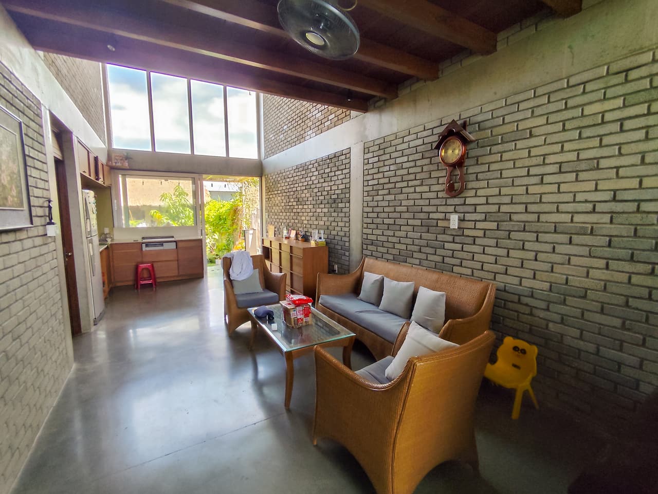 The double-height brick lounge and kitchen