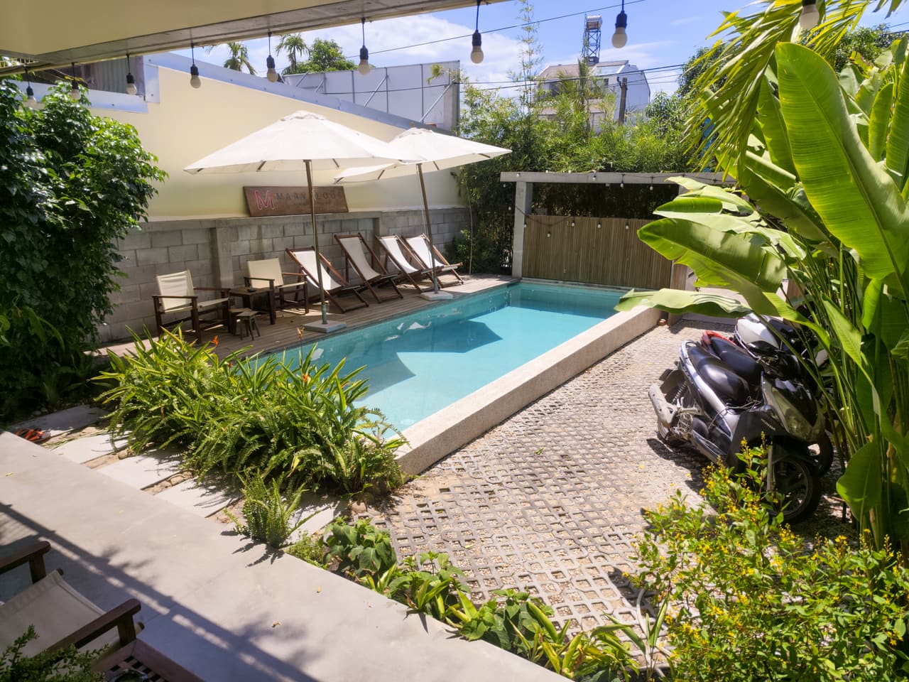 The pool, umbrellas and loungers on a sunny day
